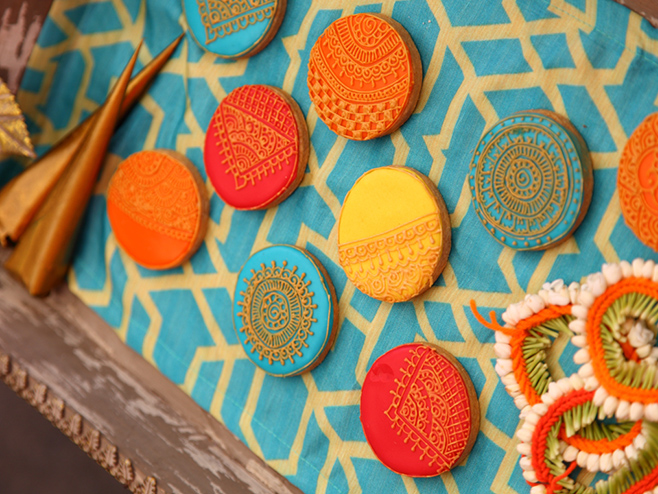 pavitra catering - colorful cookies on a blue tablecloth